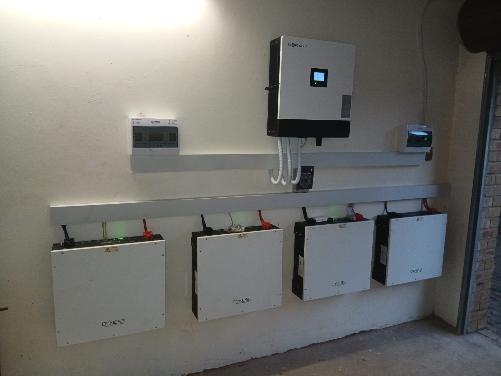 Wall-mounted inverter with a bank of four lithium batteries